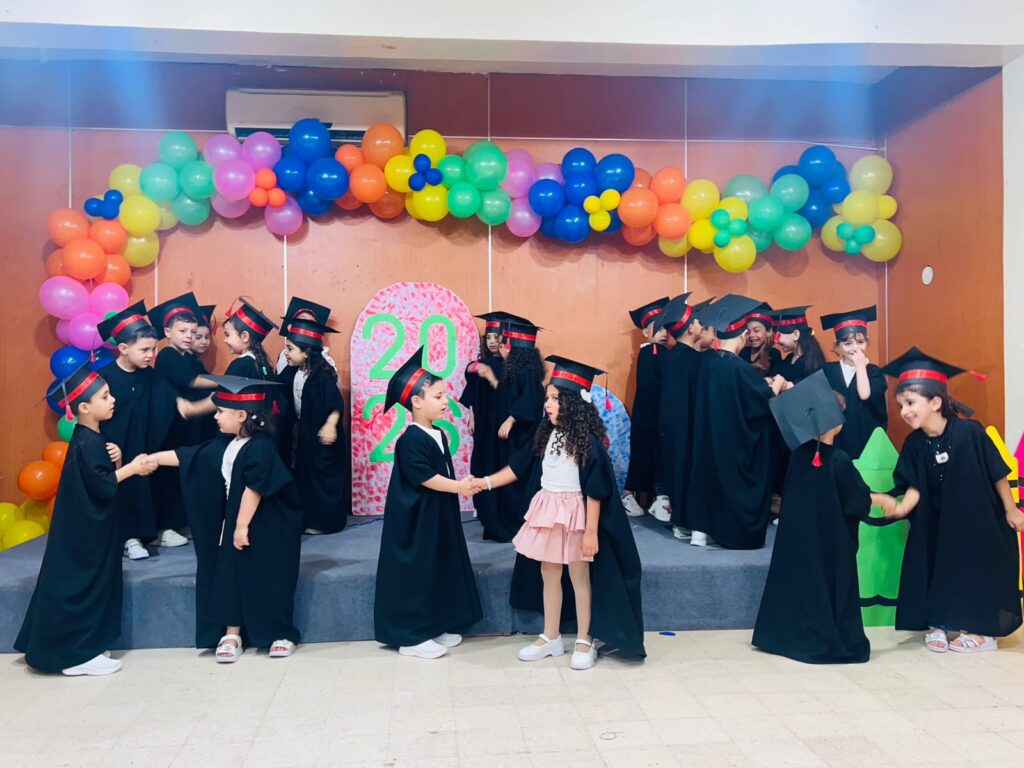 Young children in school graduation